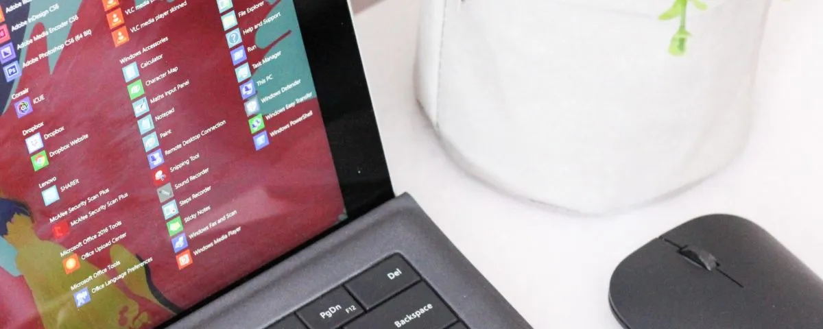 black laptop computer beside black wireless mouse