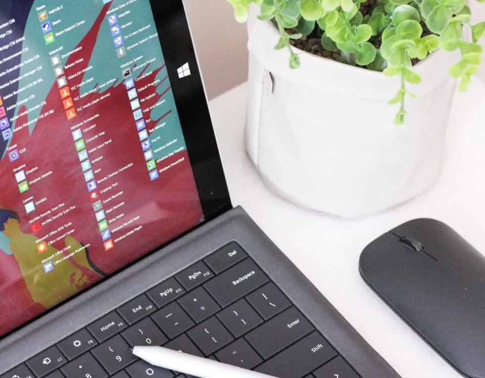 black laptop computer beside black wireless mouse