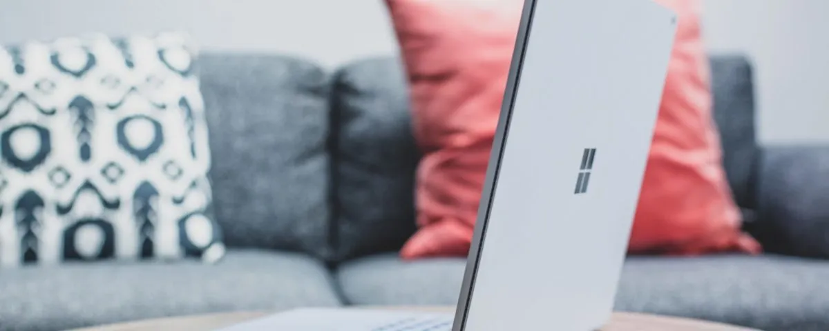macbook pro on white couch