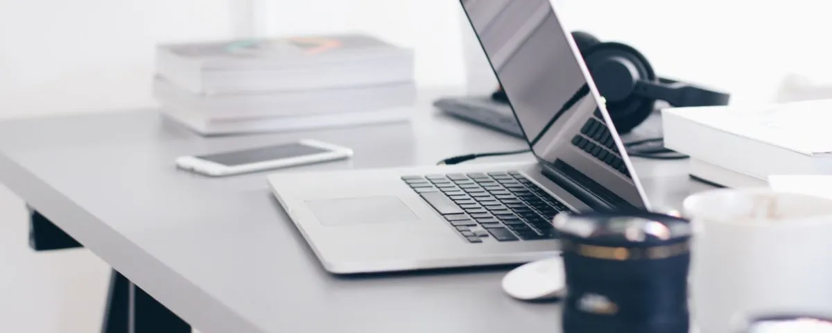 Free Gray Laptop on Table Top Stock Photo
