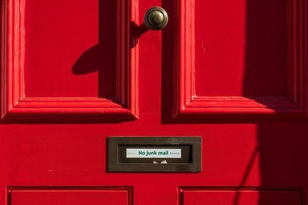 closed red wooden door closed red wooden door